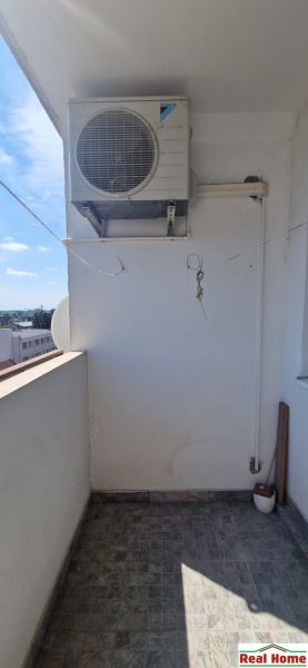 A balcony in a 2-room apartment on Hollého Street in Senec, with air conditioning.