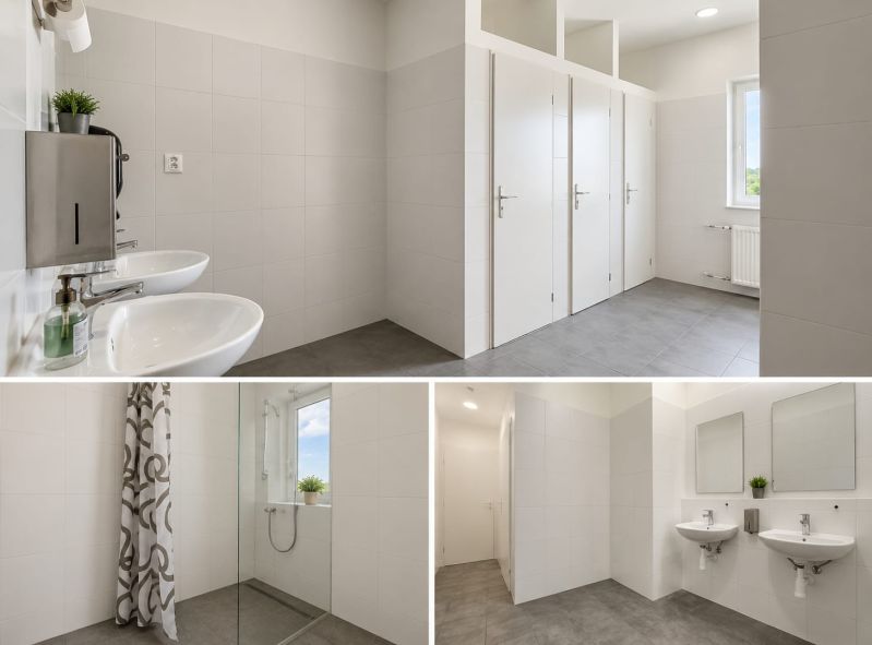 Modern sanitary facilities with sinks, showers, and toilets in warehouses and halls.