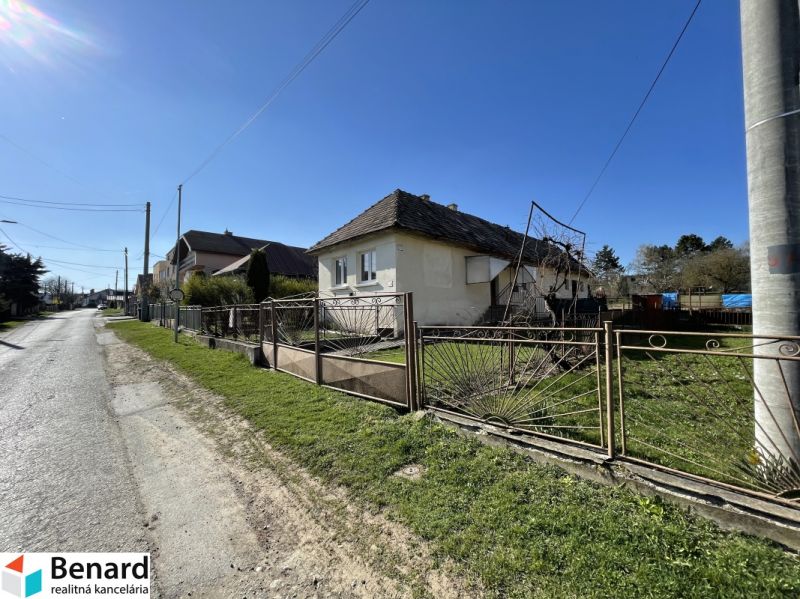 A family house on Tehelná Street in Drienov with a shabby fence and a garden.