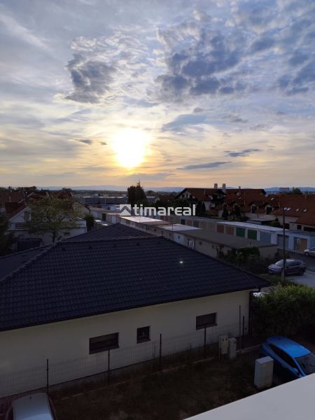 A view of Gagarinova Street in Senec from a 2-room apartment at sunset.