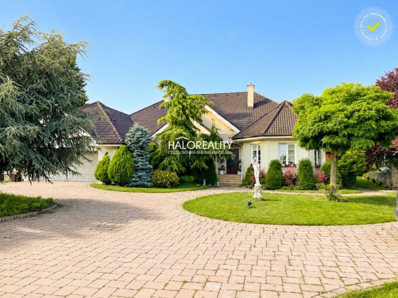 A family house in Žabokreky nad Nitrou with a well-maintained garden and a spacious driveway.