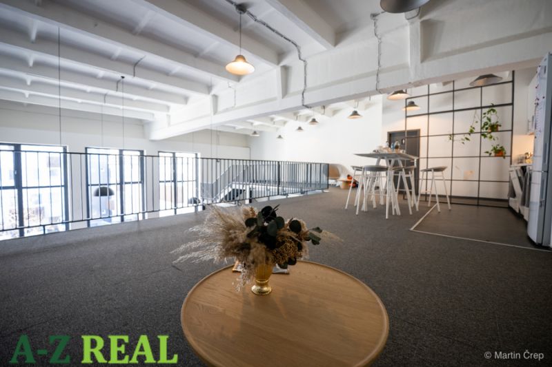 Offices with wood-patterned flooring, light-colored walls, and modern furniture.