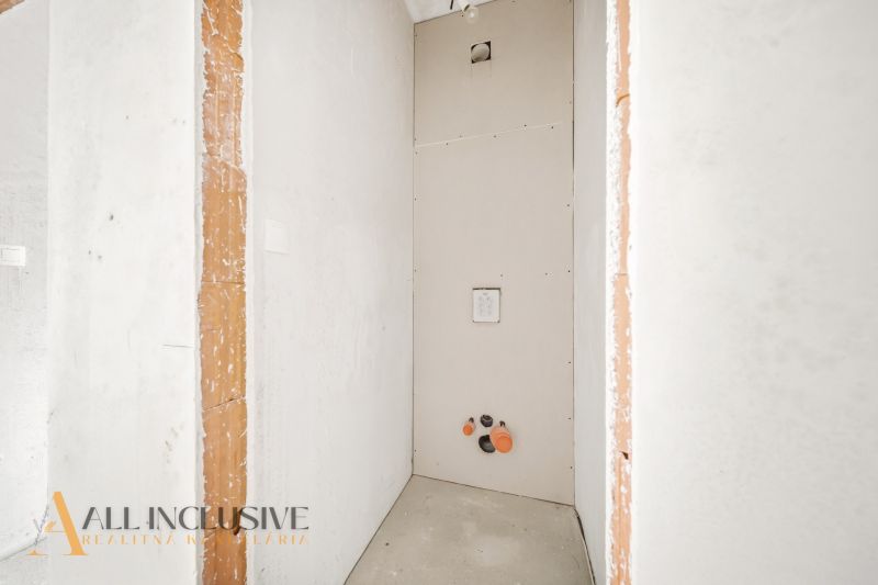 Construction in a 3-room apartment with ongoing installation for wall and floor finishing.