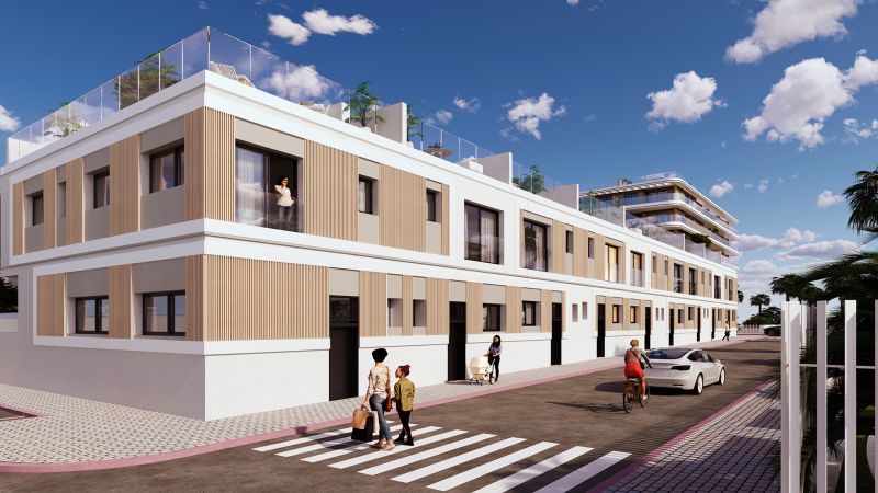 A building with a wooden facade decoration in El Puig offering 2-bedroom apartments.