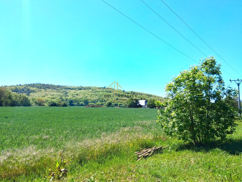 Záhorce offer residential plots with green meadows and views of wooded hills.