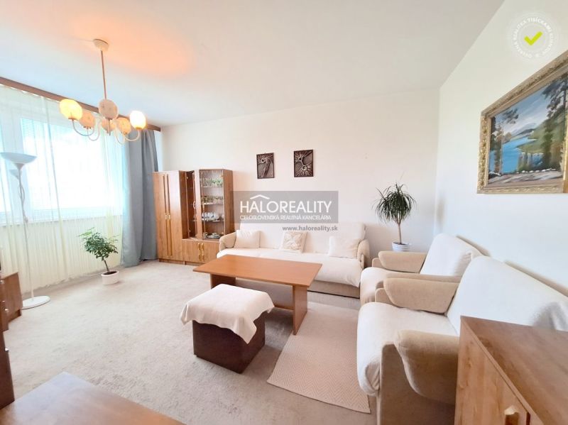Living room with a sofa and armchairs in a two-room apartment, light furnishings and carpets.