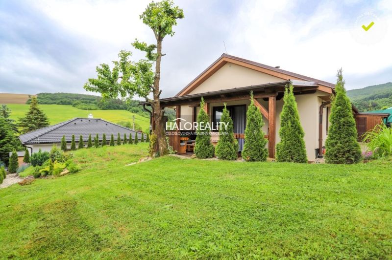 A family house in Dohňany with a landscaped garden, terrace, and views of the surrounding countryside.