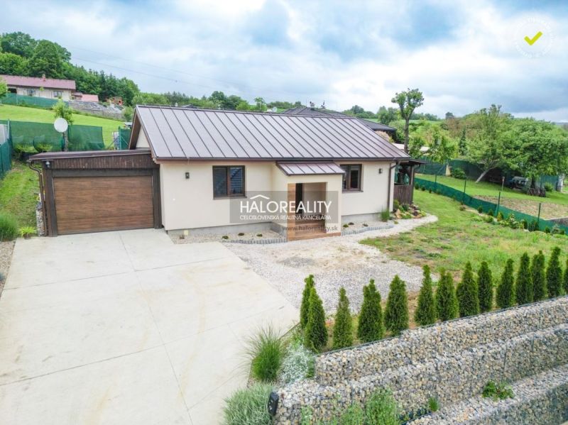 A family house in Dohňany with a garage, garden, and a paved access area.
