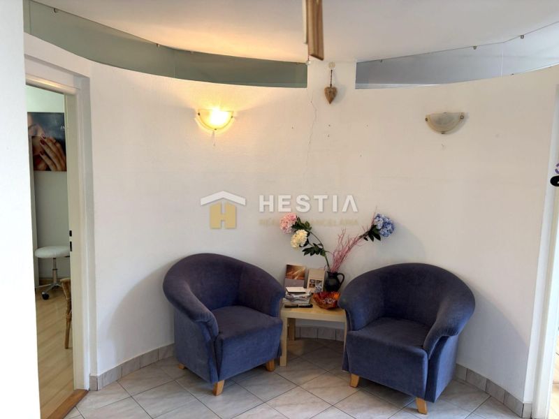 A cozy corner in commercial premises with two armchairs and decorations.