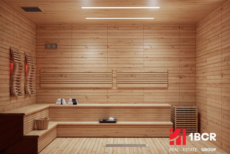 Sauna with benches and floor with wooden decor in the apartment construction project.