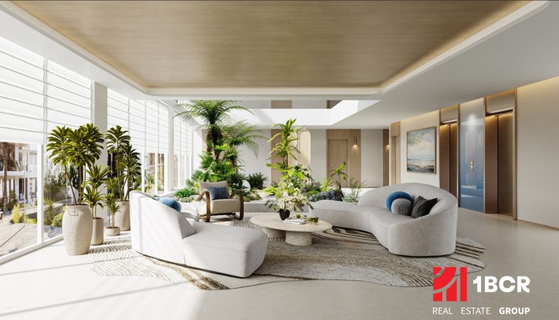 Spacious interior of apartment construction with greenery, comfortable furniture, and wood-patterned flooring.