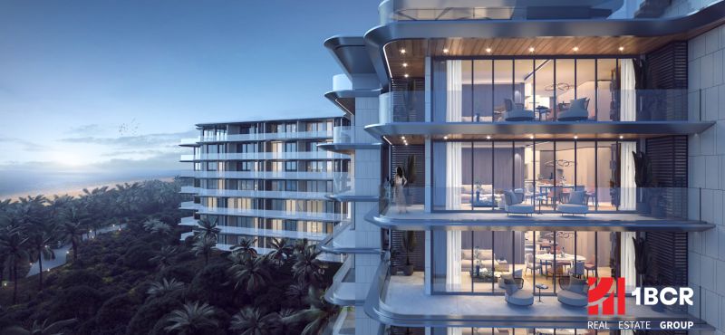 Apartment construction in Phuket with balconies overlooking the beach and sea.