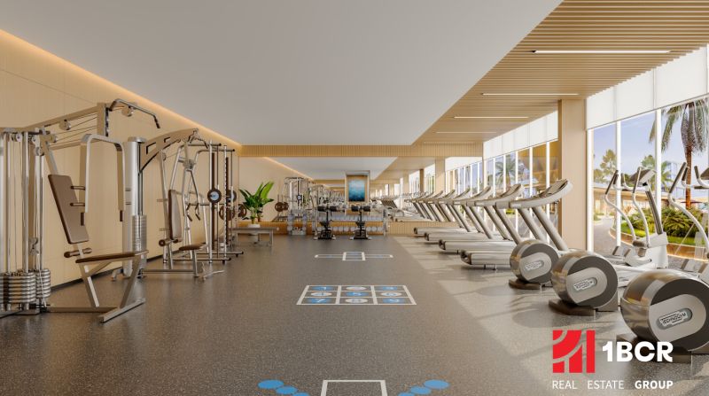 A fitness center with machines and treadmills in the apartment complex Výstavba bytov.