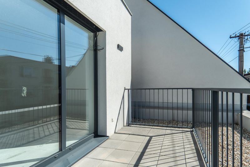 Terrace of a family house on Kľukatá Street in Bratislava - Prievoz with a tiled floor.