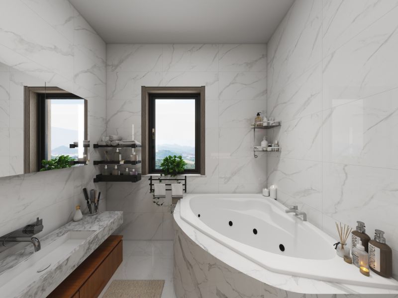 A bathroom in a family house with marble tiles, a bathtub, and windows with a view.