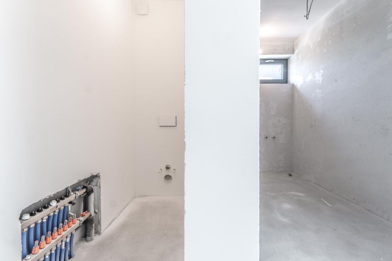 Empty space with white walls and installations in the Family House.
