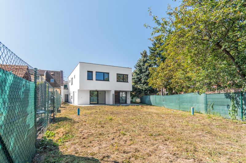 A family house on Kľukatá Street in Bratislava - Prievoz, surrounded by a green garden.