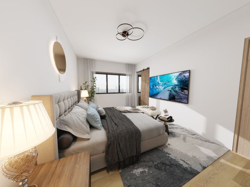 A bedroom in a family house with a wooden decor floor, a large window, and a television.