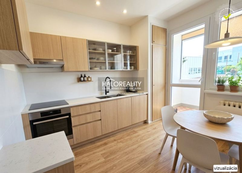 A kitchen in a 3-room apartment with a wooden decor floor and a dining table.