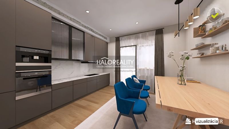 A kitchen with a wooden decor floor, a kitchen unit, and a dining table in a 3-room apartment.