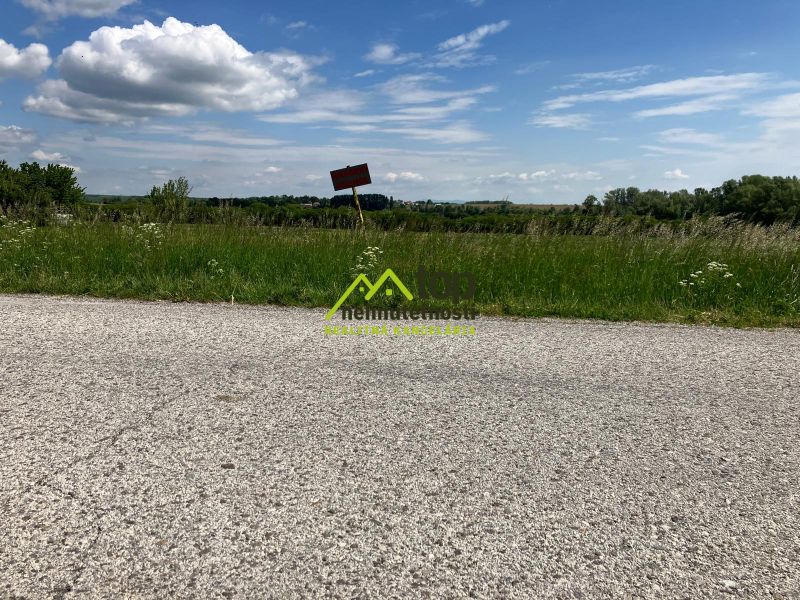 A dirt road and greenery in Krtovce ideal for residential plots.