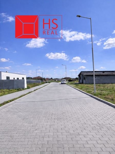 A peaceful street with new residential buildings in Dvory nad Žitavou.