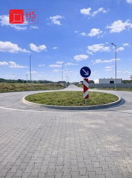 Roundabout on the properties - housing in Dvory nad Žitavou with a traffic sign.
