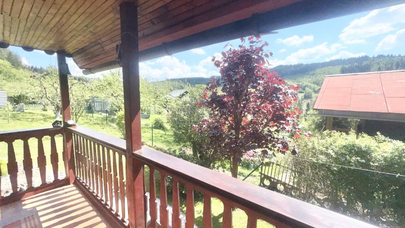 View from the cottage on Bukovská Road in Čadca, surrounded by greenery and trees.