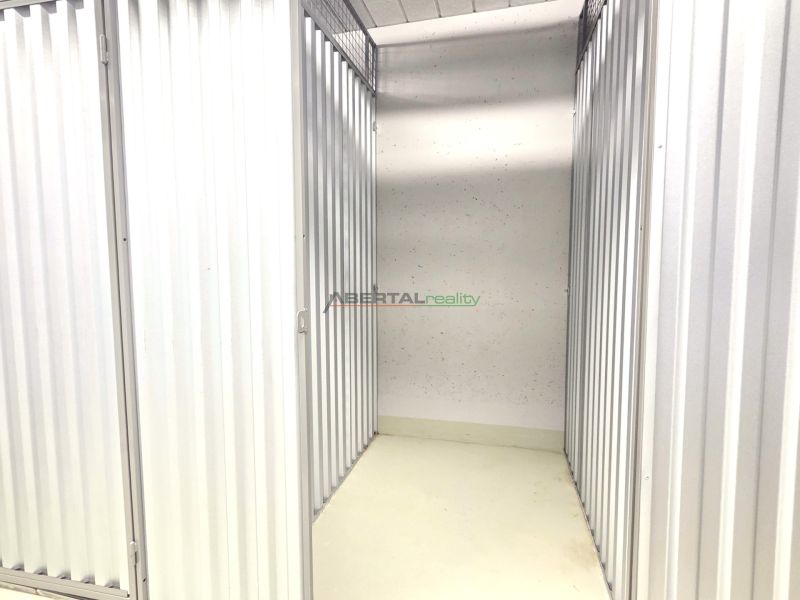A metal storage space with white walls in a 2-room apartment.