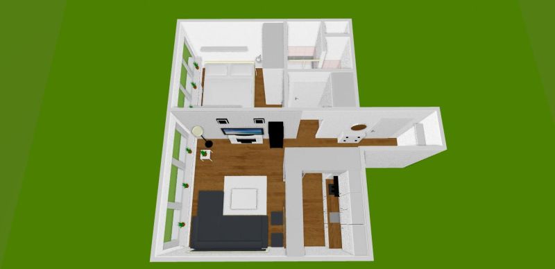 Floor plan of a 2-room apartment with wood-patterned flooring and furniture arrangement.