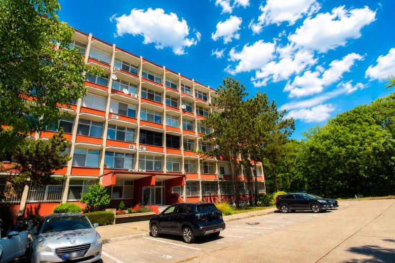 Apartment building on Vlčie Hrdlo in Bratislava - Ružinov with parking and greenery.
