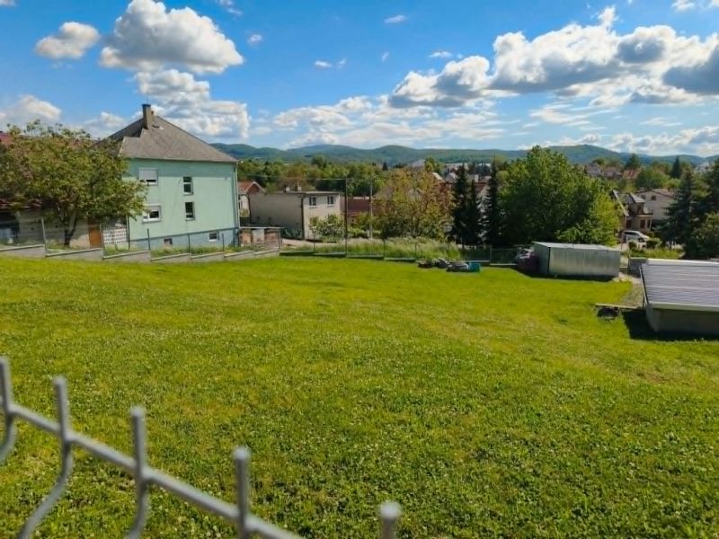 Gardens in Horná Ves, designated for residential plots, surrounded by rural architecture and greenery.