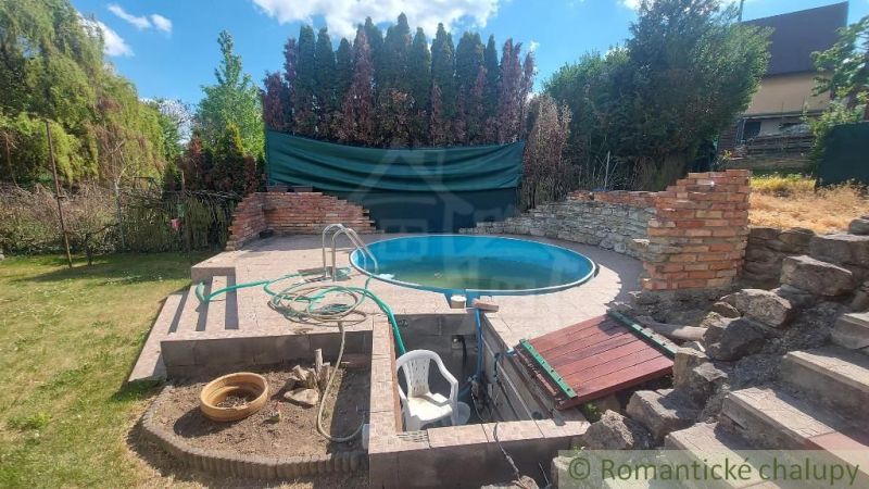 In the garden of the cottage in Holíč, there is a pool with a ceramic tile lining.