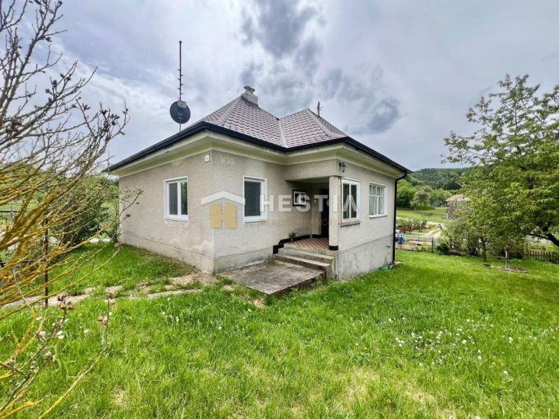 A family house in Myjava with a garden, satellite dish, and a staircase leading to the terrace.