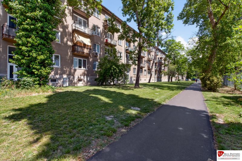 An apartment building surrounded by greenery on Obežná Street in Bratislava - Ružinov.