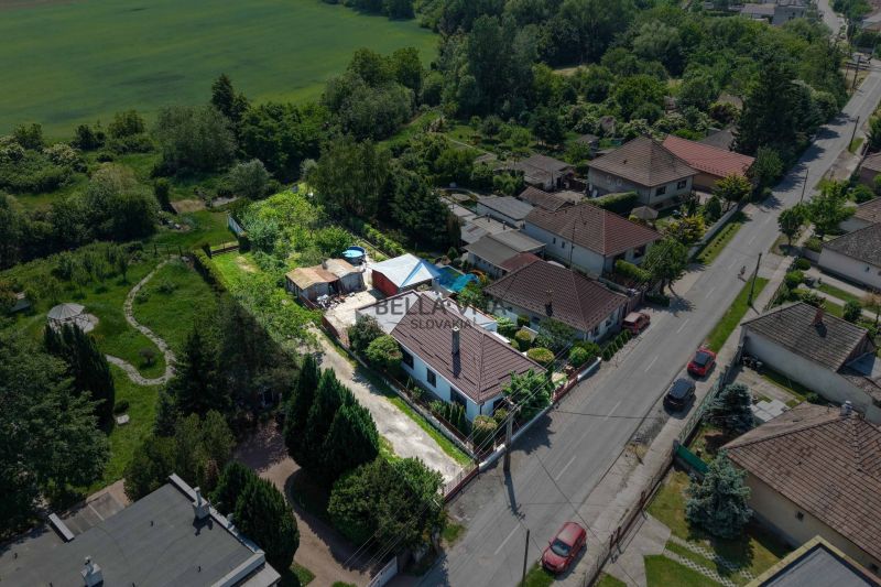 A family house in Topoľnica on Topoľnica Street with a garden and surrounding greenery.