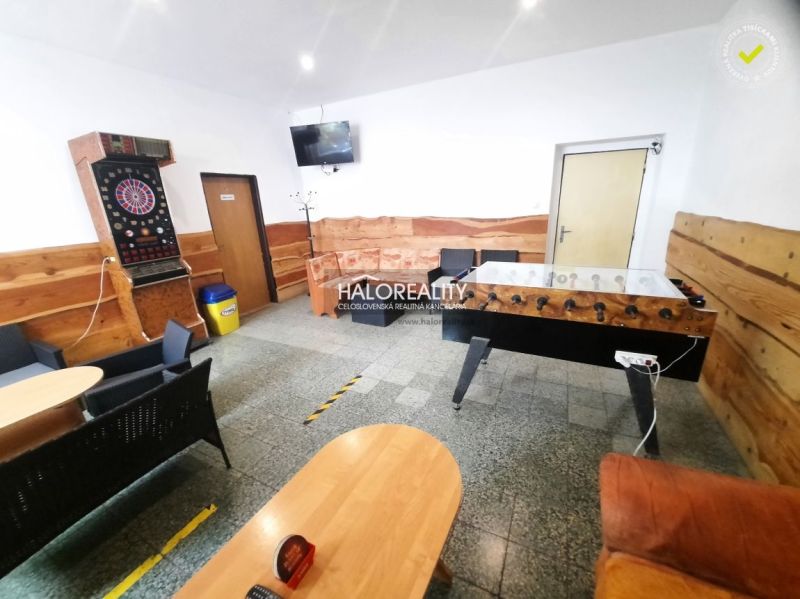 Gastro premises with wooden decor include table football and darts.