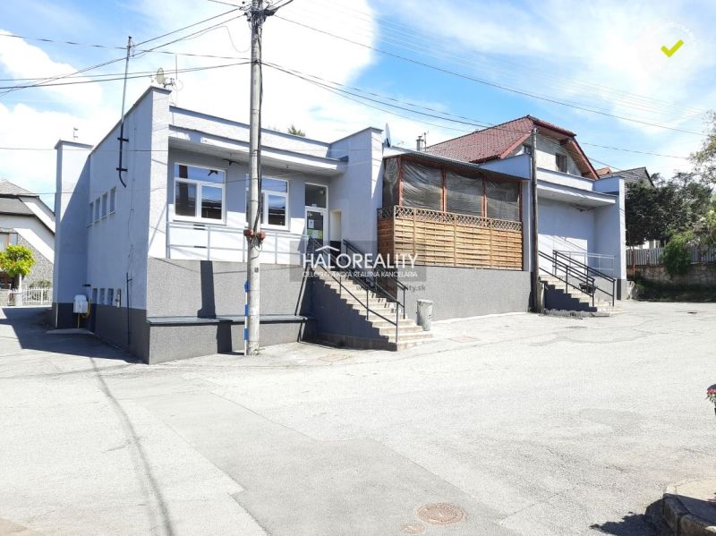 Exterior of the gastro premises on Okružná with access stairs and a glass-covered terrace.