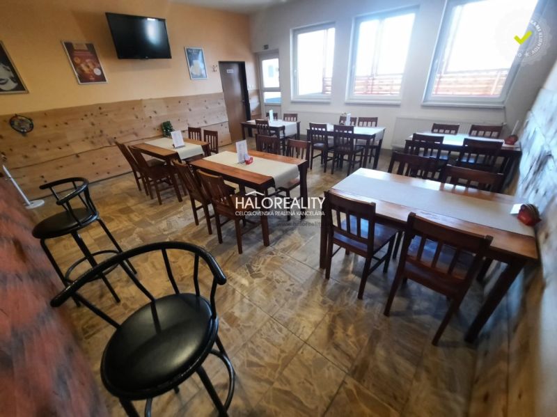 Restaurant spaces with tables and chairs, wooden decor flooring, decorations on the walls.
