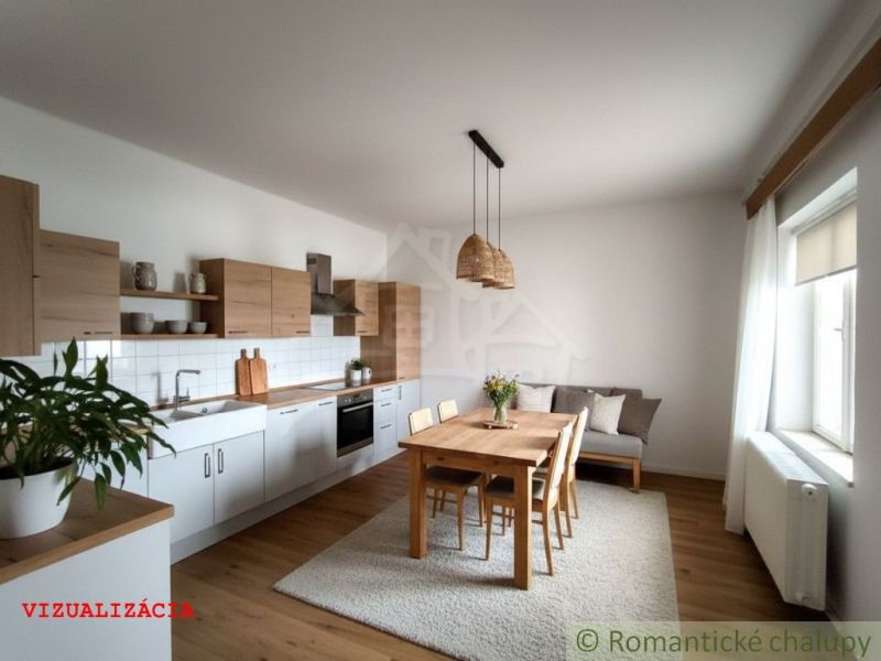 Kitchen space in a cabin with a wooden decor floor and a dining table.