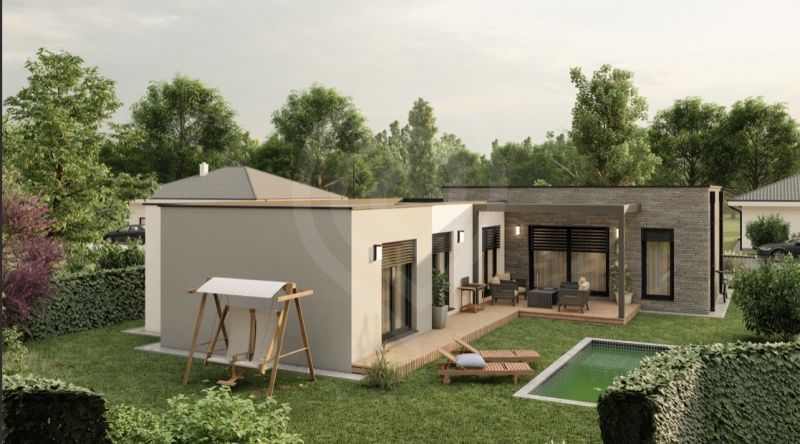 A family house on Slnečná Street in Miloslavov with a terrace, swimming pool, and garden seating.
