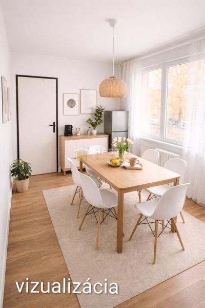 A designer dining room with wood-patterned flooring and stylish furniture in a 3-room apartment.