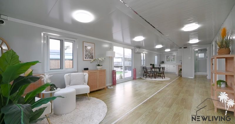 Interior of a family house with a wooden decor floor, a bright and spacious area.