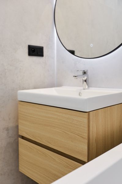 Bathroom cabinet with sink and mirror in a 4-room apartment.