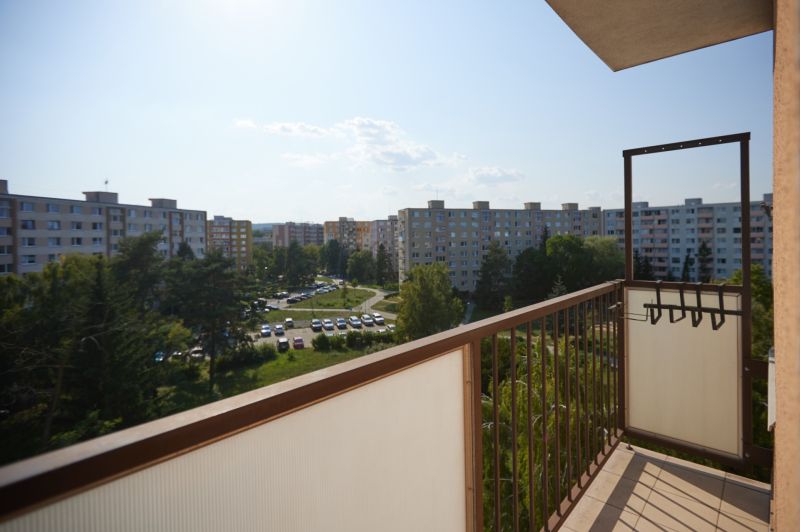 View from the balcony on Humenská, Košice - Západ district, with greenery and apartment buildings.