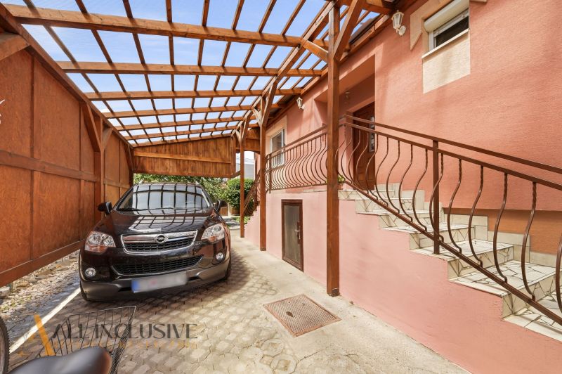 A shelter with a car and a staircase at a family house in Gabčíkovo allows for convenient access.