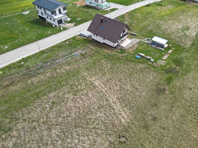 Aerial view of residential plots in Malý Slavkov by the road.