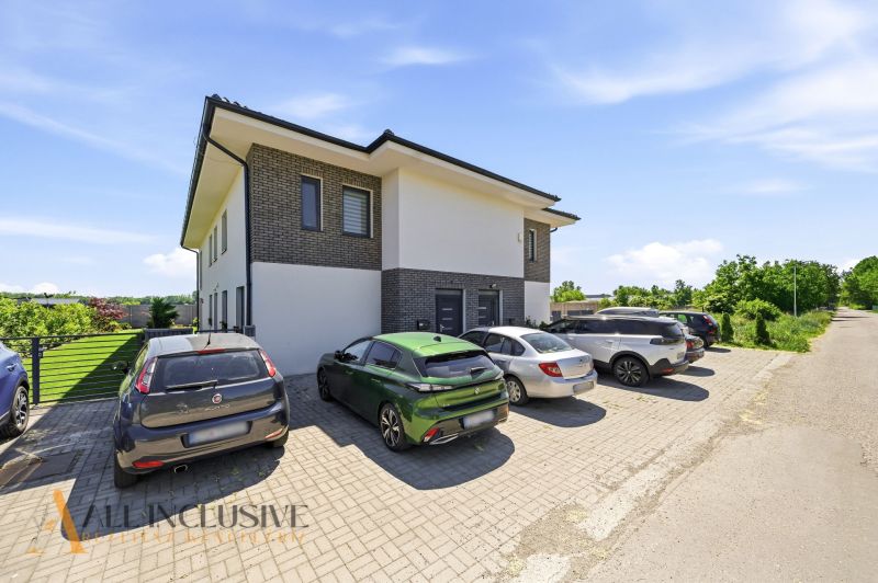 Parking lot near a two-story house with greenery in the town of Horný Bar, 3-room apartment.