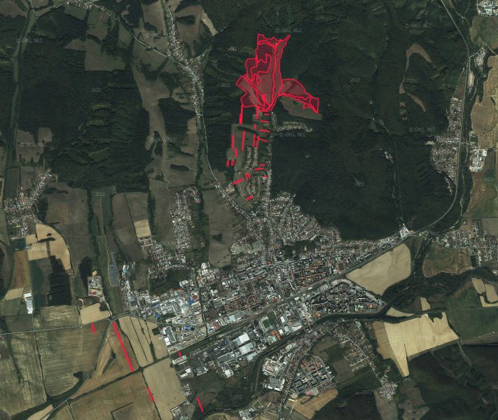 Aerial view of agricultural and forest land in Humenné, highlighted in red.