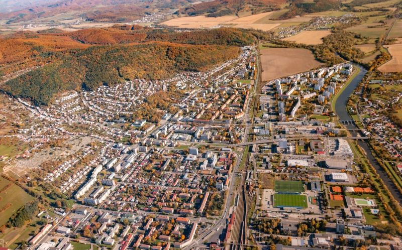 Aerial view of agricultural and forest land in Humenné with urban development.